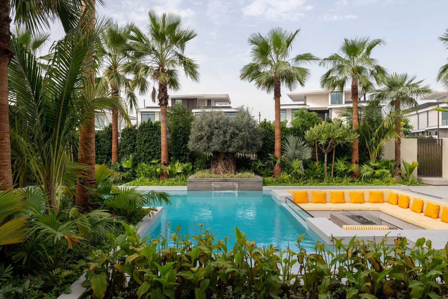 How To Turn Your Pool Area Into A Lush Tropical Retreat